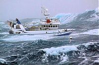 Transport: fishing ship in the middle of a storm