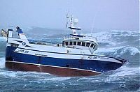 Transport: fishing ship in the middle of a storm