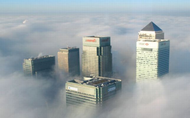 bird's-eye view of buildings above the clouds