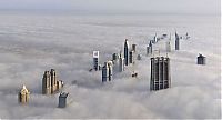 World & Travel: bird's-eye view of buildings above the clouds
