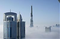 World & Travel: bird's-eye view of buildings above the clouds