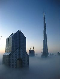 World & Travel: bird's-eye view of buildings above the clouds