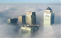 World & Travel: bird's-eye view of buildings above the clouds