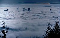 World & Travel: bird's-eye view of buildings above the clouds