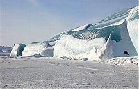 World & Travel: Blue ice from frozen waves, Antarctica