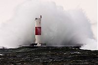 World & Travel: lighthouse in waves