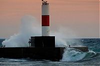 World & Travel: lighthouse in waves