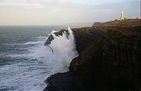 World & Travel: lighthouse in waves