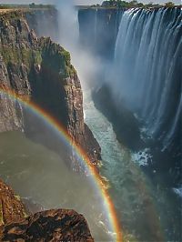 World & Travel: Rainbow over Victoria Falls, Zambezi River, Africa