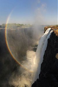 World & Travel: Rainbow over Victoria Falls, Zambezi River, Africa